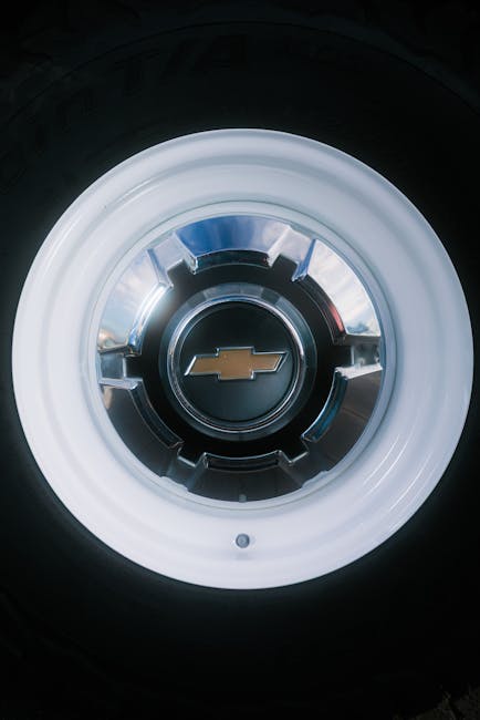 Close up of a polished vintage Chevrolet hubcap